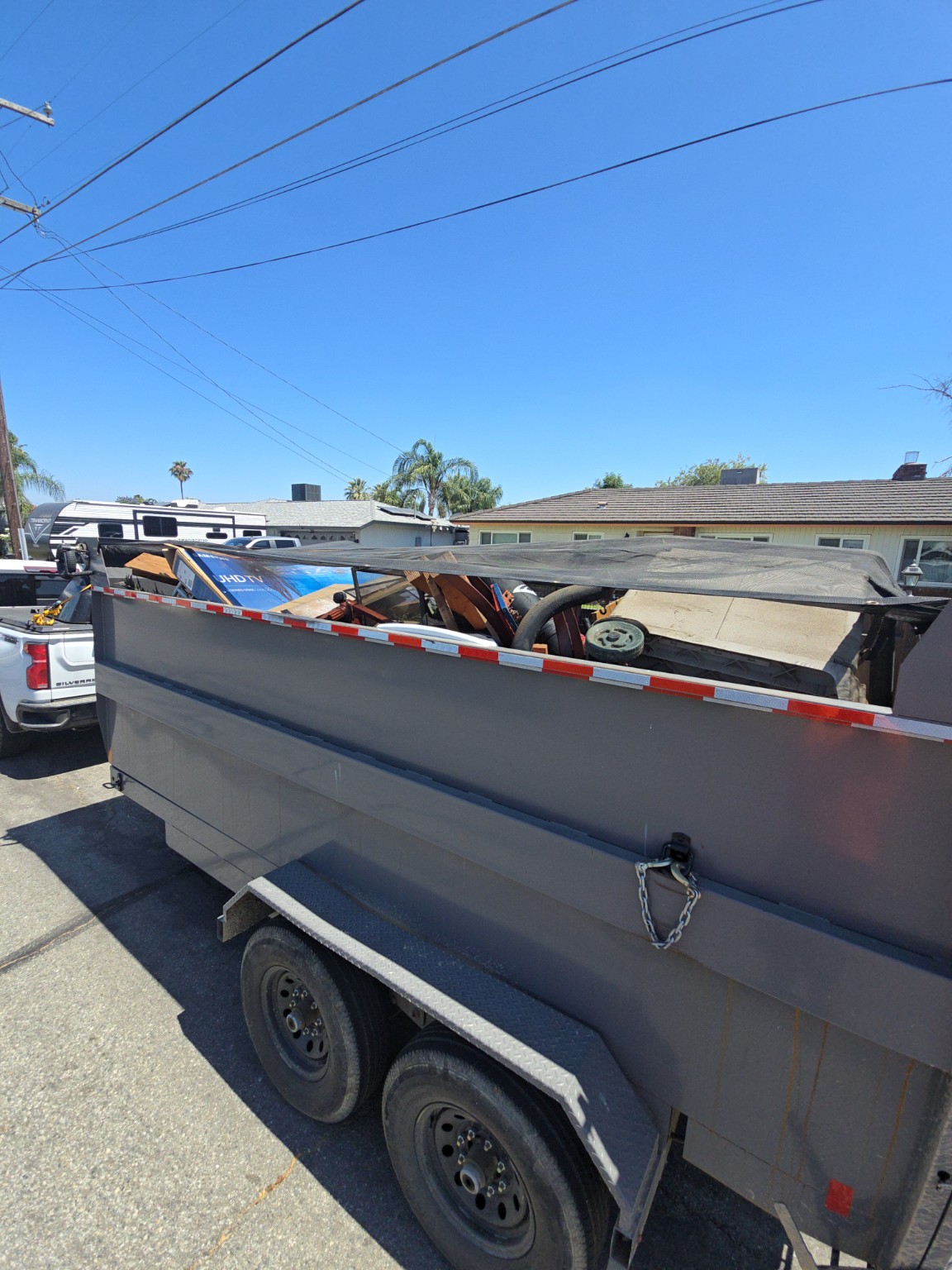 Loaded dump trailer after a junk removal job