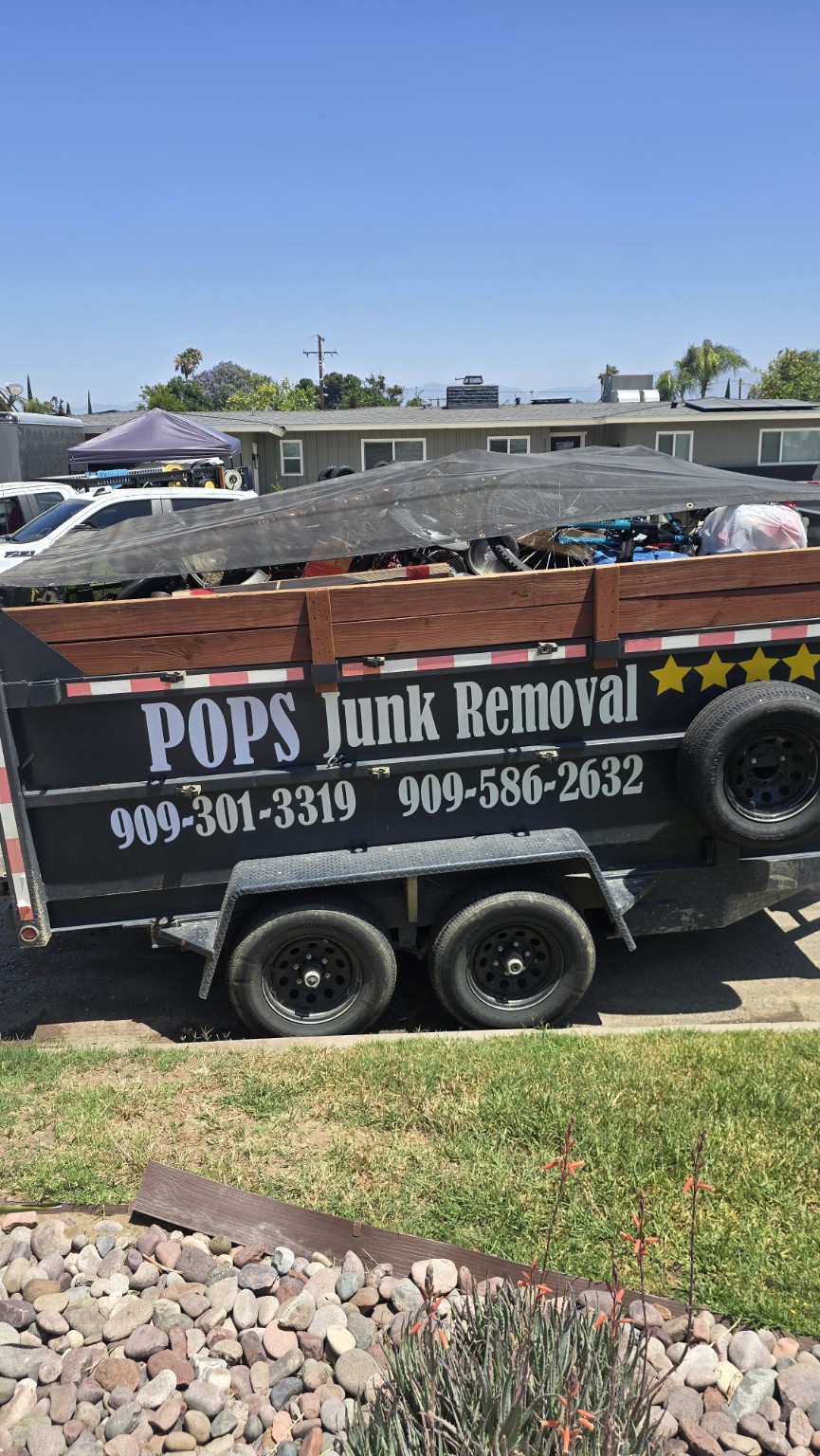 Pop's Junk Removal branded dump trailer